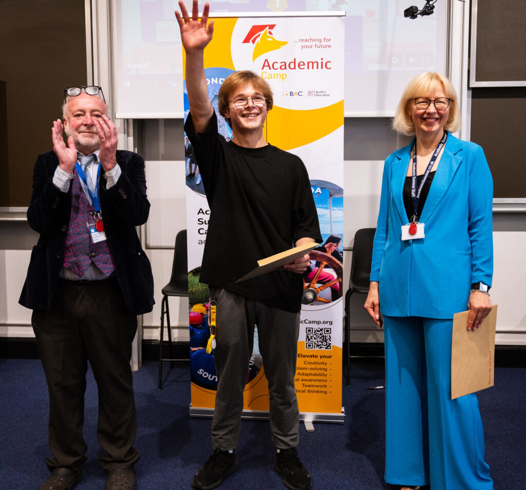 Vincent Smidowicz and Dr Giedrė Balčytytė with a student at David Game College.